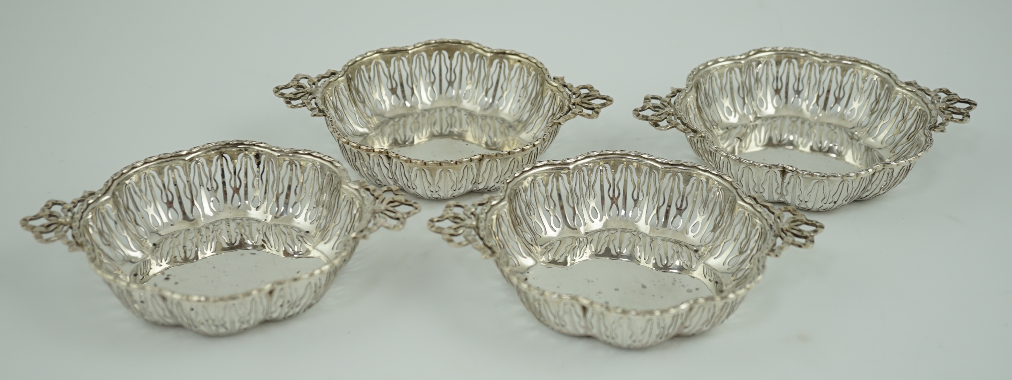 A set of four George V pierced silver bon bon dishes, by Mappin & Webb